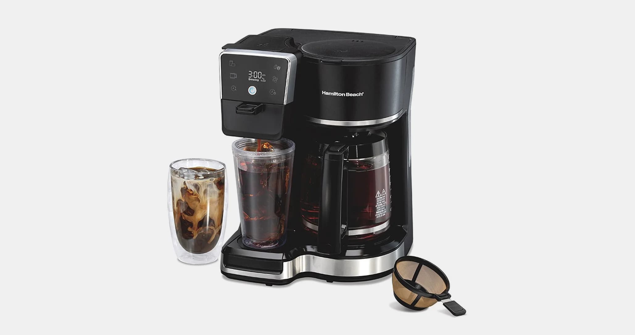 A sleek black coffee maker with digital display, brewing a carafe and iced coffee in a glass. Includes a reusable filter. Modern and efficient.