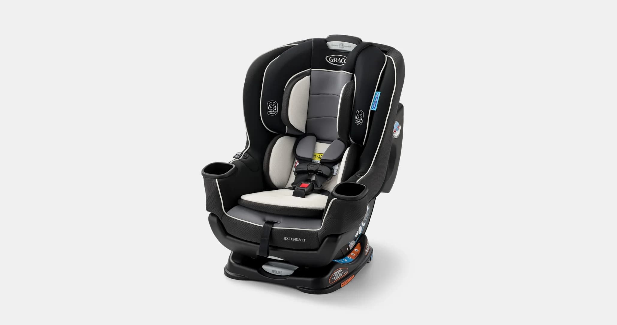 A black and gray child car seat with cup holders on both sides, featuring harness straps and plush padding, is displayed against a plain white background.